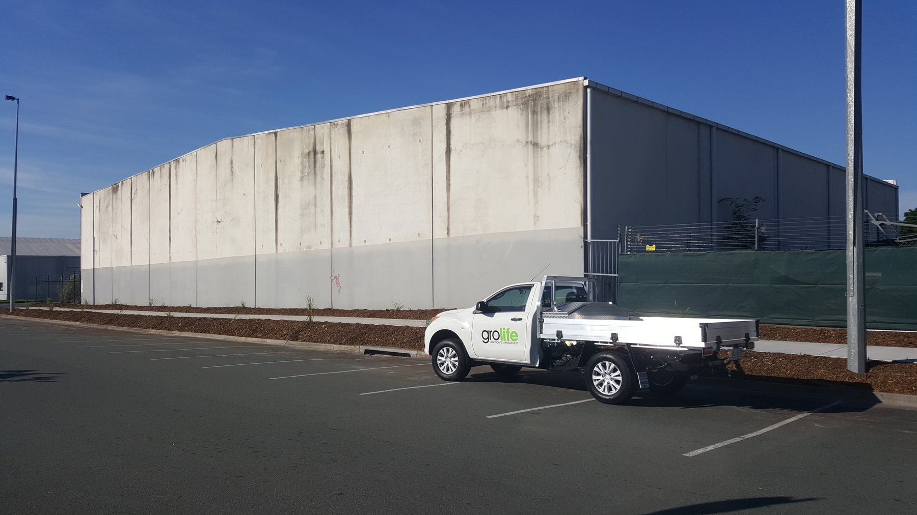Stafford City Shopping Centre — wide finished view of the new footpath alongside the centre wall with a Grolife branded ute parked